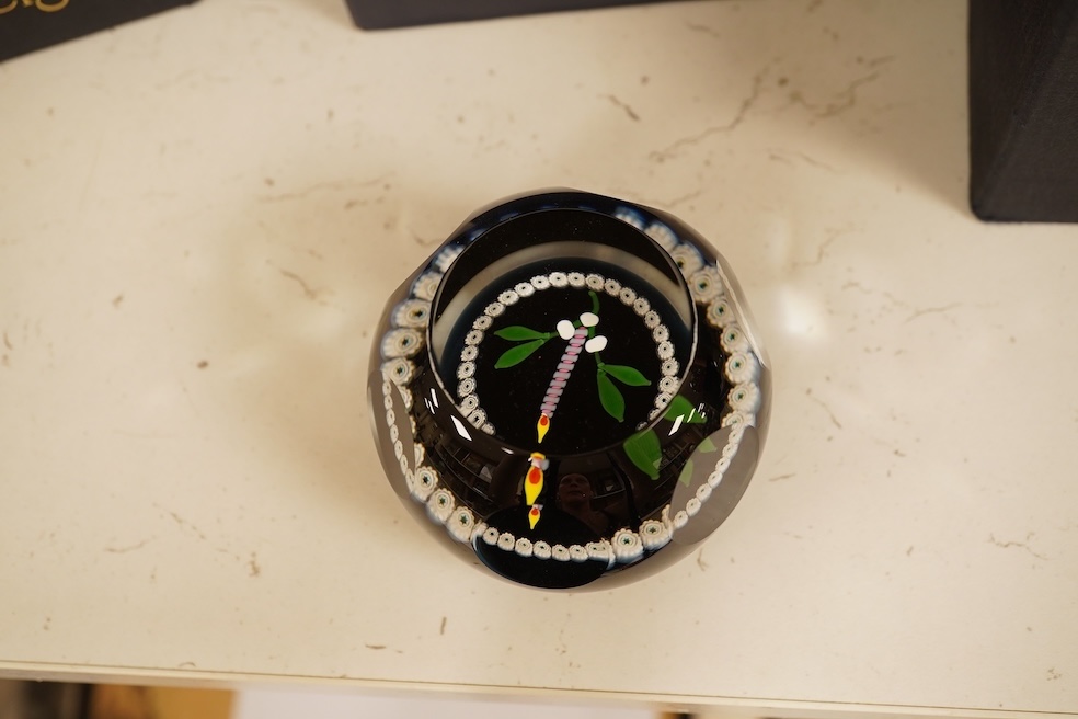 Four Caithness boxed paperweights to include ‘Garland’ and boxed Langham paperweight